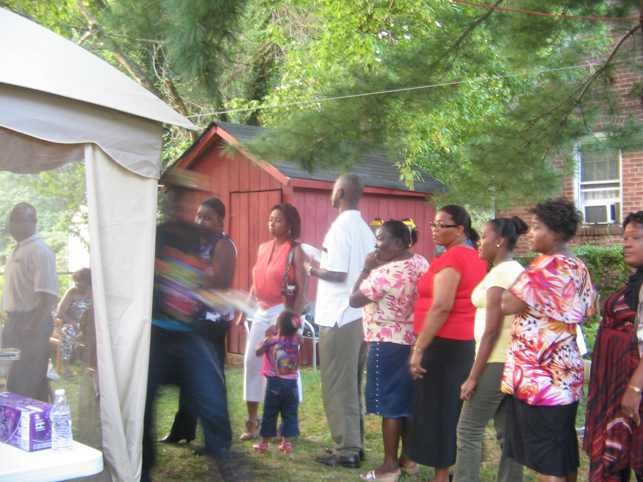 Community members receiving support services during an outreach visit