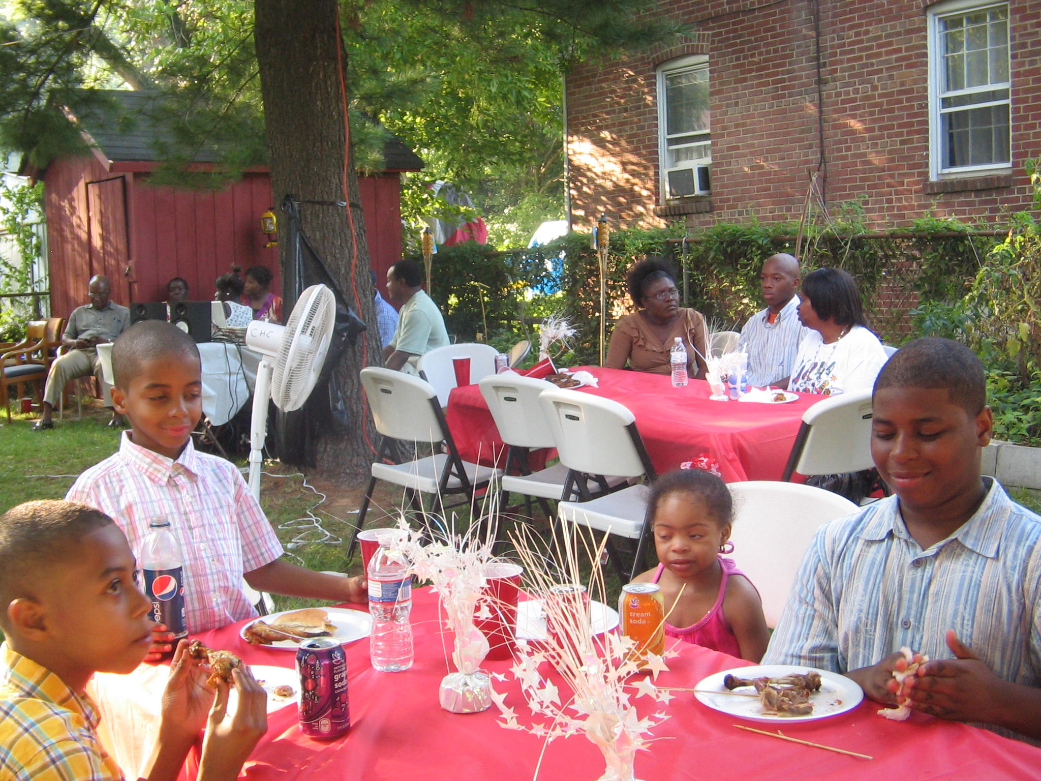 Support volunteers assisting residents at a public event