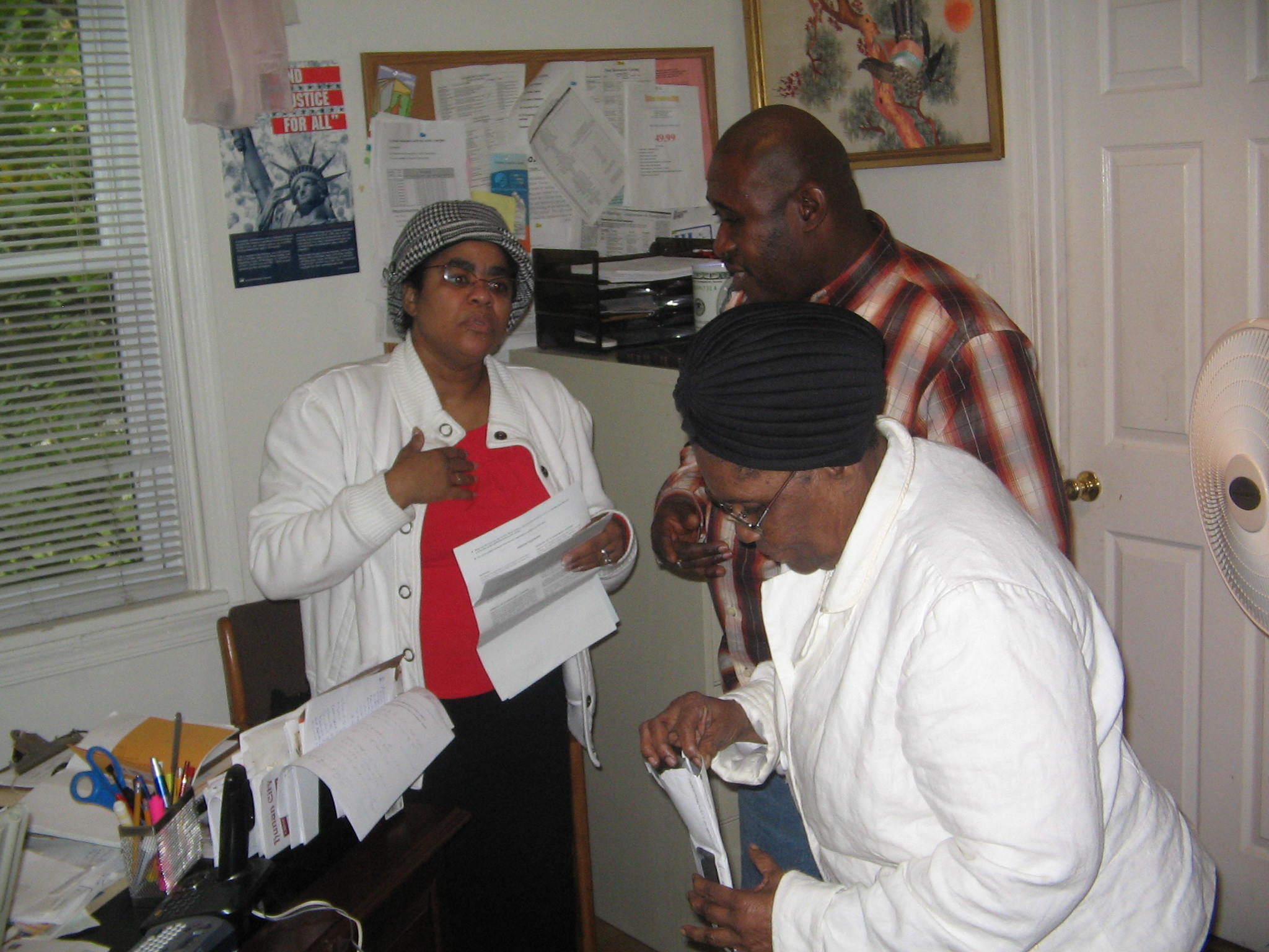 Community members at a service desk receiving guidance