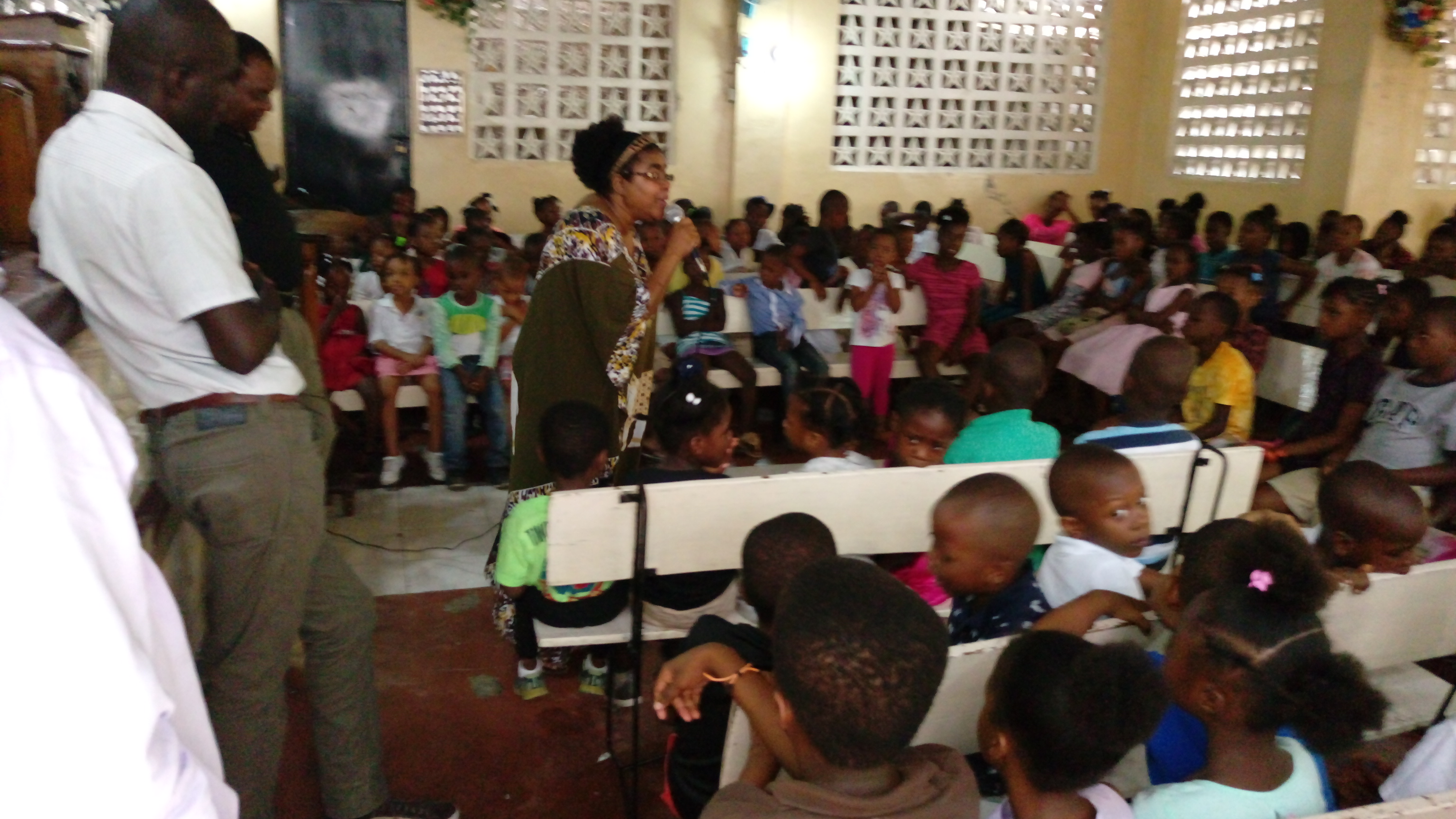 Community members participating in a Caribbean Help Center outreach program