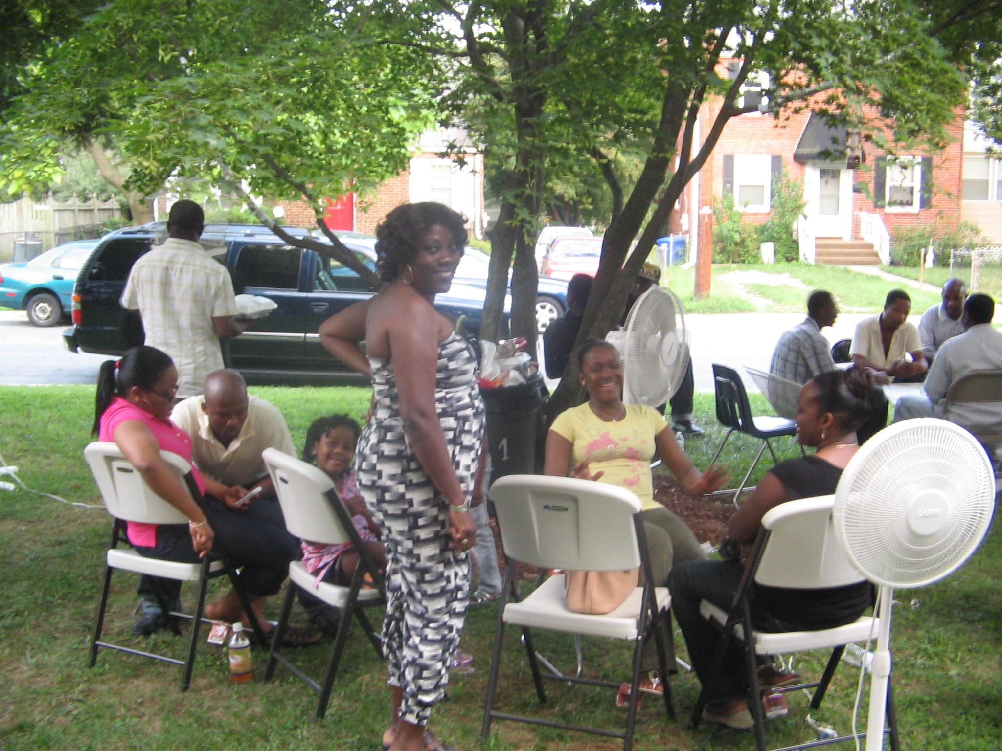 Community members participating in an outreach activity with volunteers